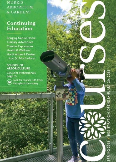 The cover of a catalog that reads, "Morris Arboretum & Gardens Spring 2025 Courses" with an image of a young girl looking through large binoculars.